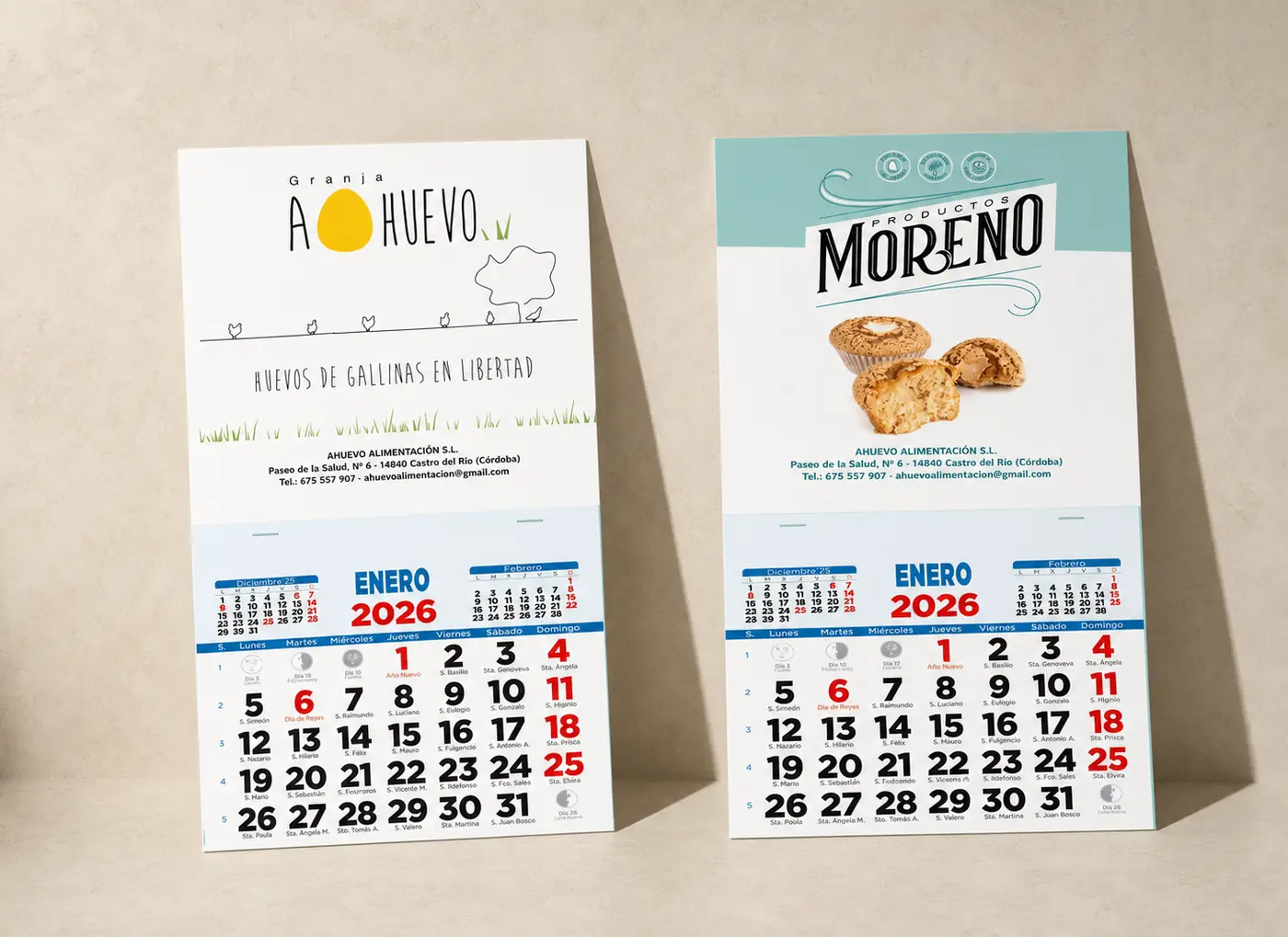 Dos calendarios de pared publicitarios con cabeceras distintas